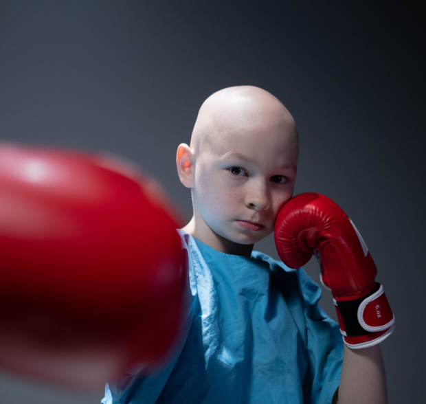 A child in boxing gloves